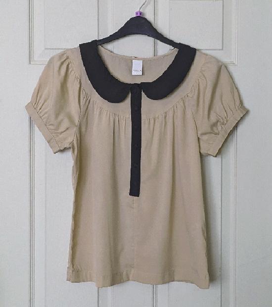 Preview of the first image of Pretty Ladies Short Sleeve Blouse By Vila - Size L.
