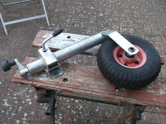 Preview of the first image of Pneumatic caravan/trailer jockey wheel and clamp.