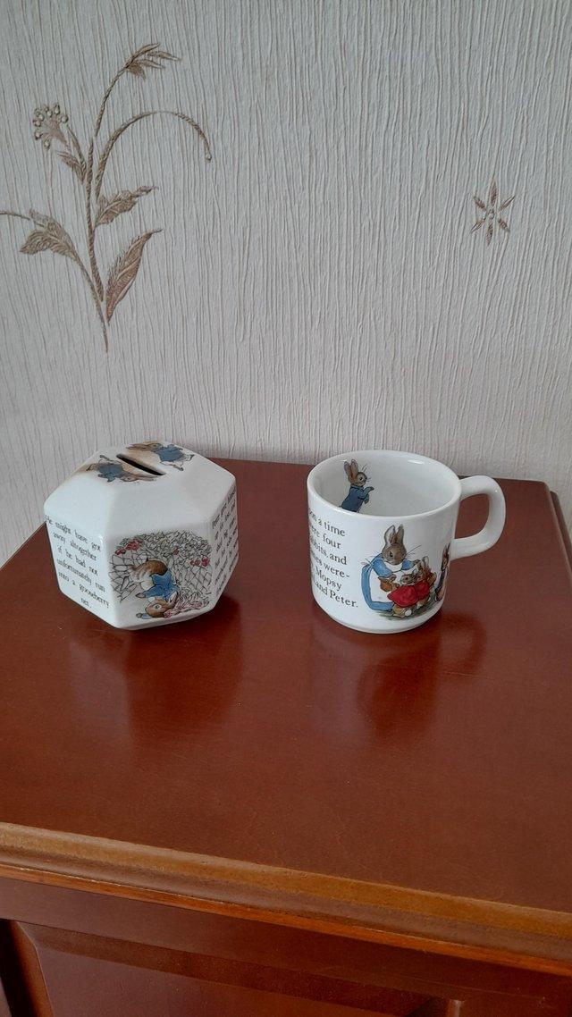 Preview of the first image of Wedgwood,PeterRabbit mug and moneybox.