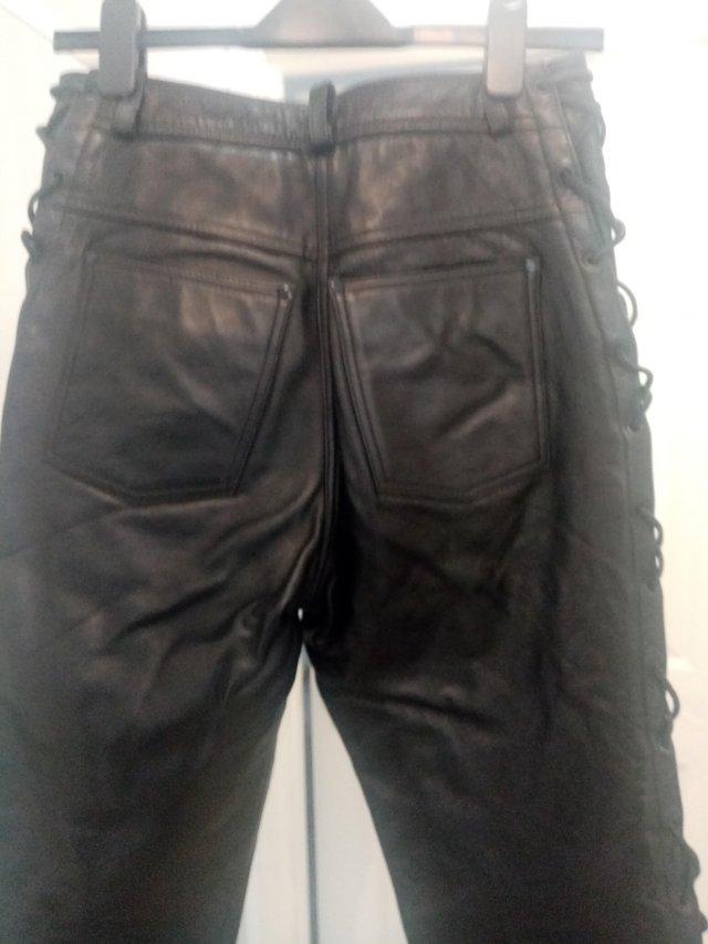 Preview of the first image of Ladies leather laced side motorcycle jeans, black..