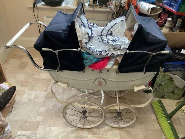 Preview of the first image of Vintage coachbuilt twin dolls pram.