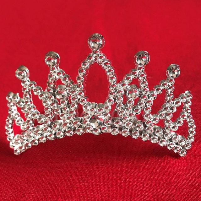 Preview of the first image of Mini tiara hair comb in silver coloured plastic..