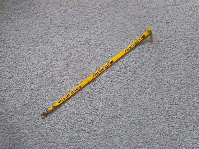 Preview of the first image of Porsche Lanyard (Breakaway, Yellow with Black Logo).