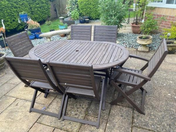 Image 1 of Garden Table and 6 chairs(2 carvers + 4 reg) seats 6