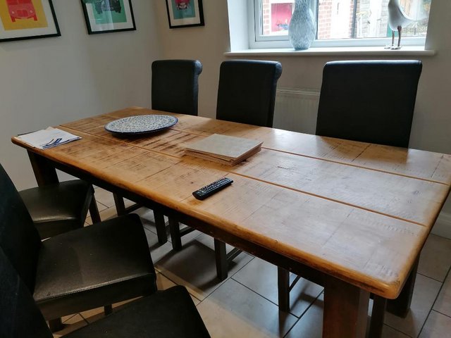 Preview of the first image of Solid Wooden table with 6 leather chairs.
