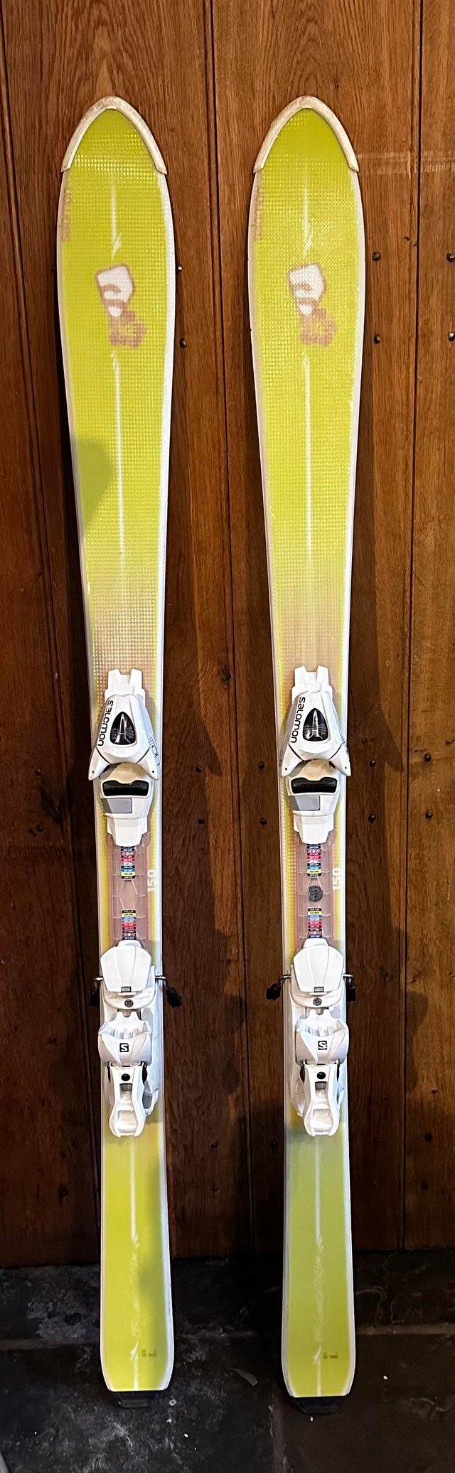 Preview of the first image of Lime green Skis with excellent white Salmon bindings.
