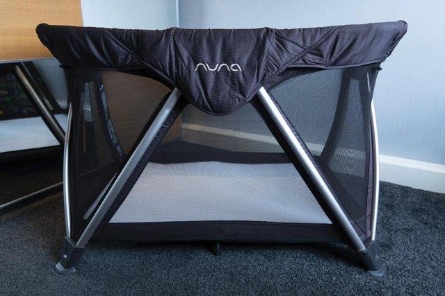 Preview of the first image of Nuna Sena Aire Travel Cot & Bassinet in Charcoal RRP £250.