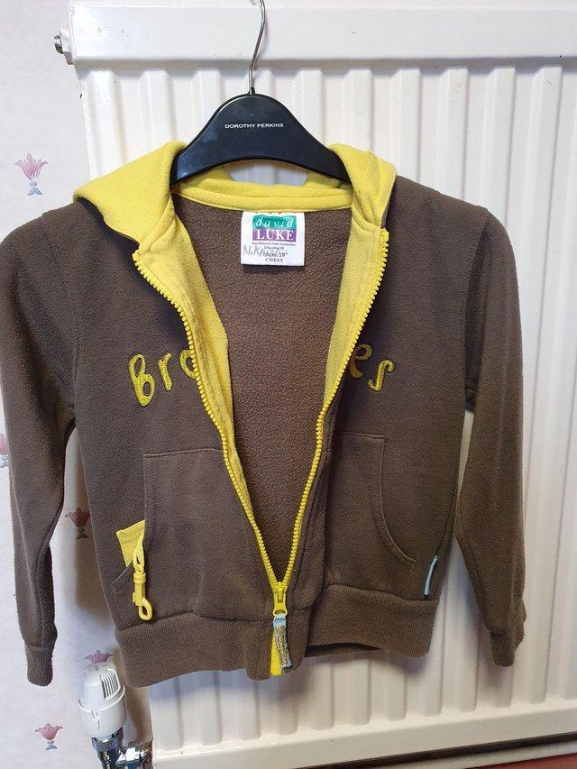 Preview of the first image of Brownie uniform yellow and brown hoodie..