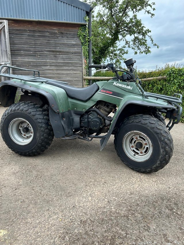 Preview of the first image of Kawasaki KLF 300 Quad bike (and trailer).