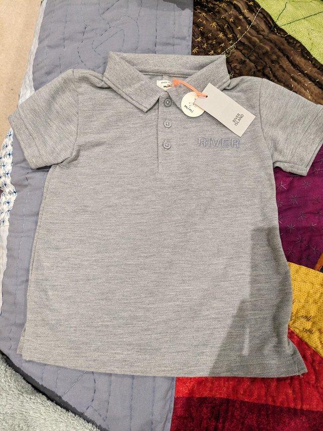 Preview of the first image of River Island age 2 -3 years polo neck top- Grey Artisan Folk.