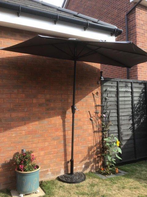 Preview of the first image of For Sale - Half Garden Umbrella & Half Cast Iron Base.