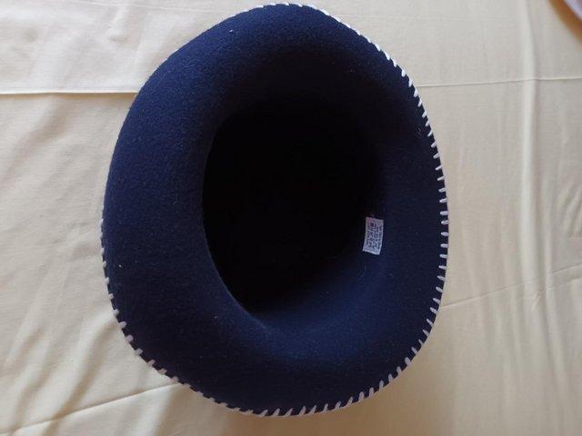 Preview of the first image of Navy Felt Woolen Hat with White Trim Stitching.