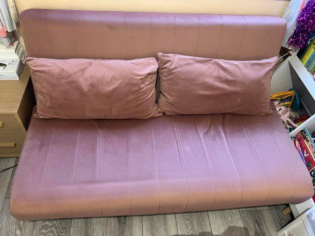 Preview of the first image of MADE large double pink velvet sofa bed.