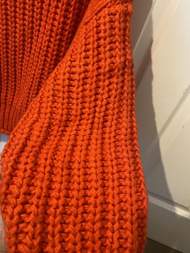 Preview of the first image of H&M orange oversized jumper.