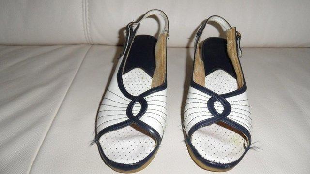 Preview of the first image of Vintage 1960's ladies blue and white ladies sandals.