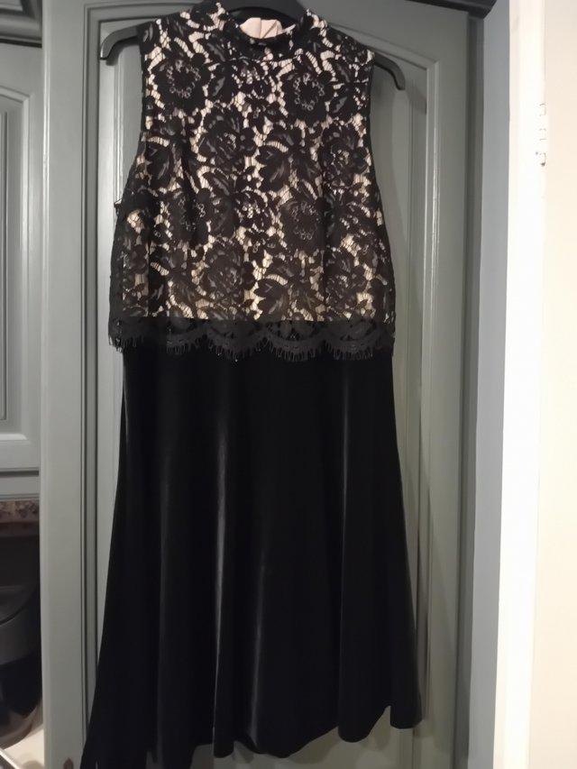 Preview of the first image of NEXT Black velvet and lace dress.
