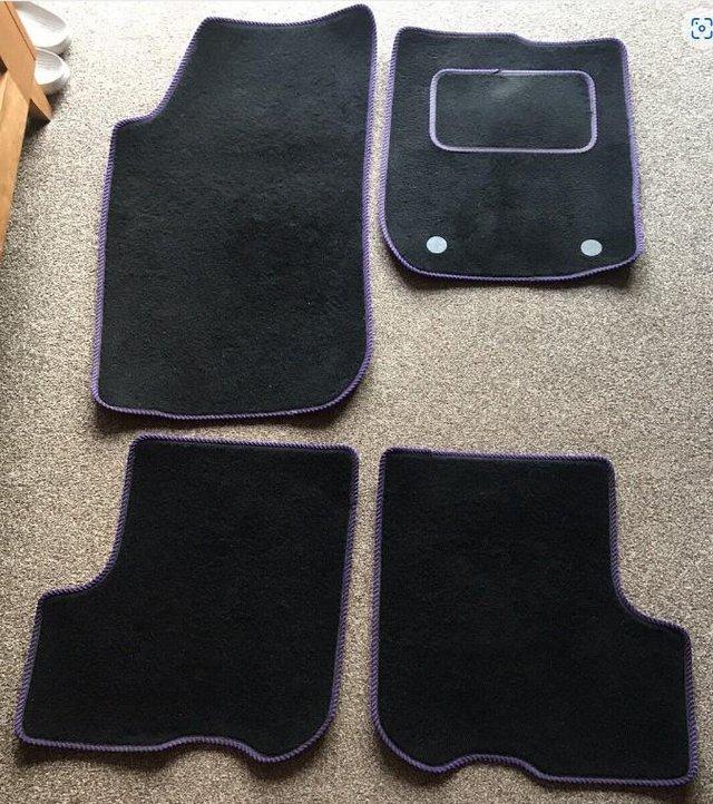 Preview of the first image of Black Luxury Tailored Car Mats Purple Binding.