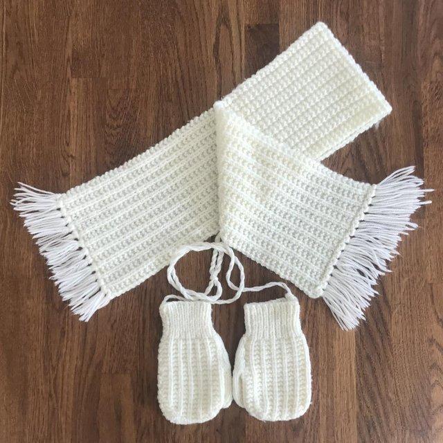 Preview of the first image of Vintage 1980's hand-knitted toddler's cream scarf & mittens..