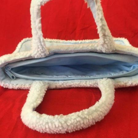 Image 3 of Unused M&S pale blue suede and lambs wool effect handbag.