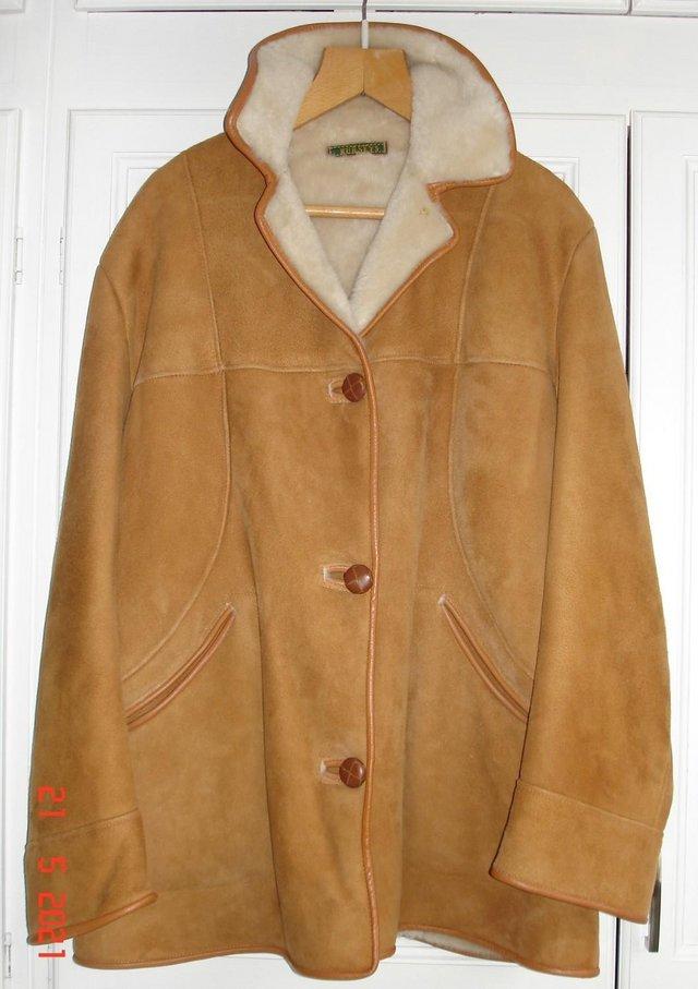 Preview of the first image of Genuine Nurseys 3/4 Length Ladies Sheepskin coat.