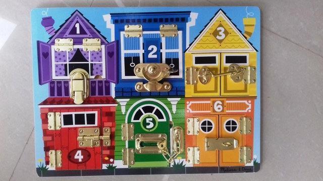 Preview of the first image of WOODEN TOY-MELISSA & DOUG-Latches Play Board.