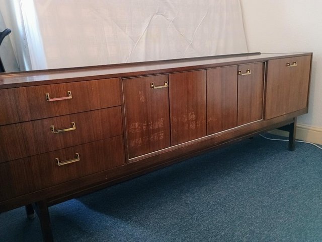 Preview of the first image of Large Teak Mid-century G-plan sideboard and brass handles.