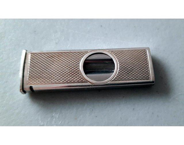 Preview of the first image of 1973 W M Ltd Silver Cigar Cutter Engine Turned Geometric.