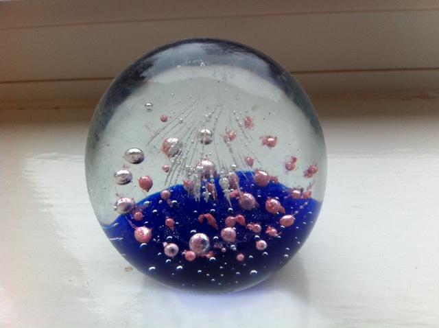 Preview of the first image of Beautiful glass paperweight, fascinating design.