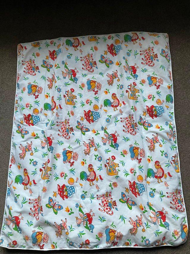 Preview of the first image of Light weight cot or travel cot duvet,good condition.