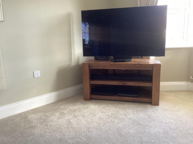 Preview of the first image of Dark oak corner tv stand up to 55”.