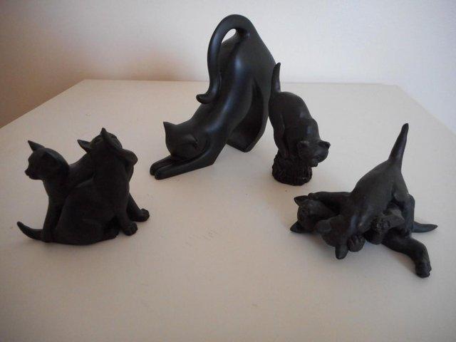 Preview of the first image of 4 LOVELY BLACK CATS FIGURES WITHOUT BOXES.