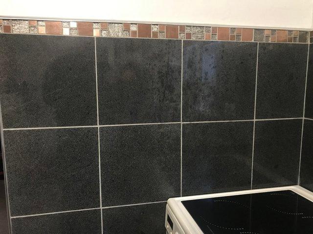 Preview of the first image of Polished black granite tiles for sale.