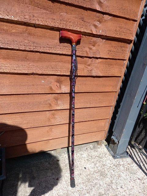 Preview of the first image of Ladies floral foldable walking stick.
