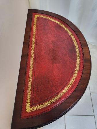 Image 1 of Half moon red leather inset top table