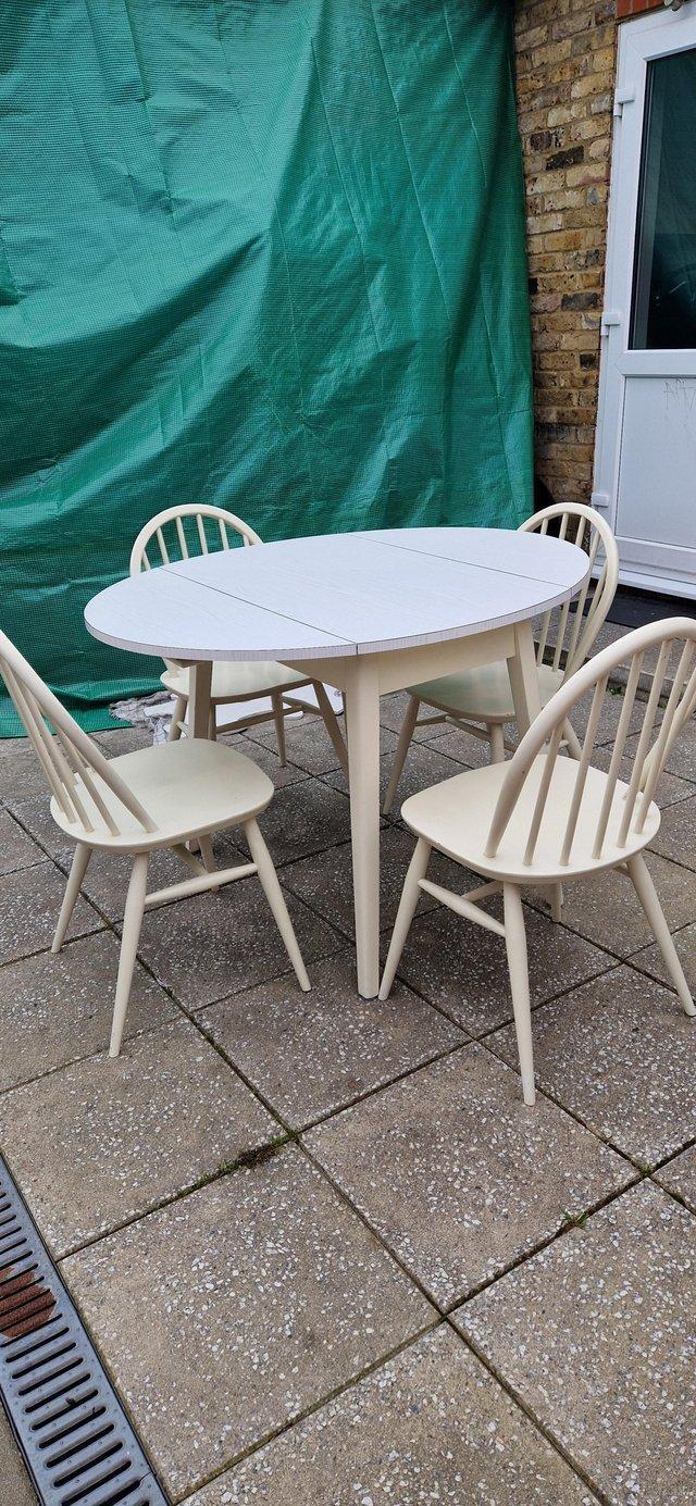 Preview of the first image of Mid Century Ercol dining chairs x 4.