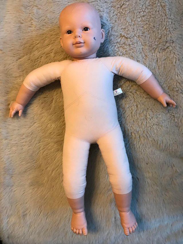 Preview of the first image of Demonstration doll for baby massage.