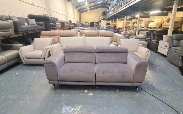 Preview of the first image of New Sienna grey fabric electric recliner 3 seater sofa.