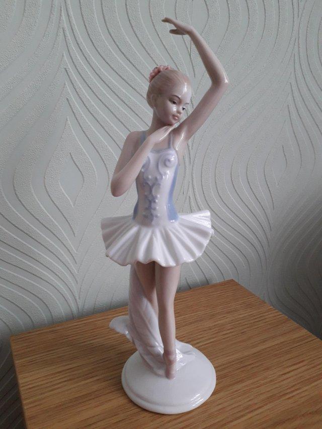 Preview of the first image of Julianna Collection Ballerina Arm in Air.
