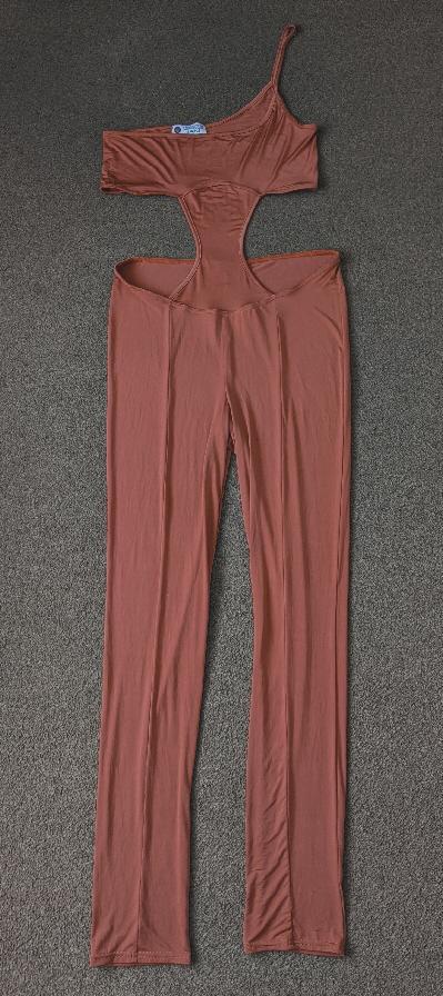 Preview of the first image of Gorgeous Burnt Orange Jumpsuit By Fashion Point Apparel.