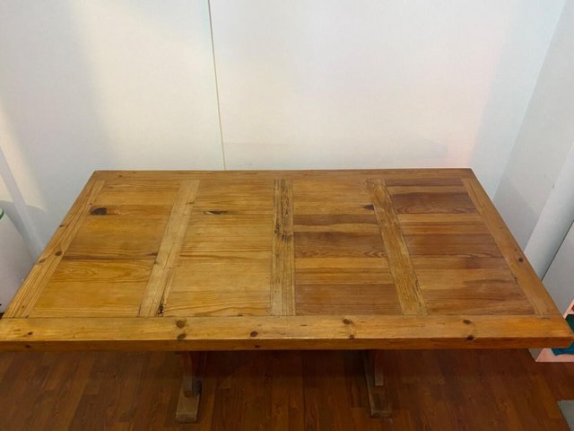 Preview of the first image of Rustic solid wood dining table, made in Mexico.