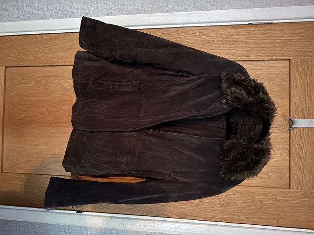 Preview of the first image of Suede leather coat with fur collar.