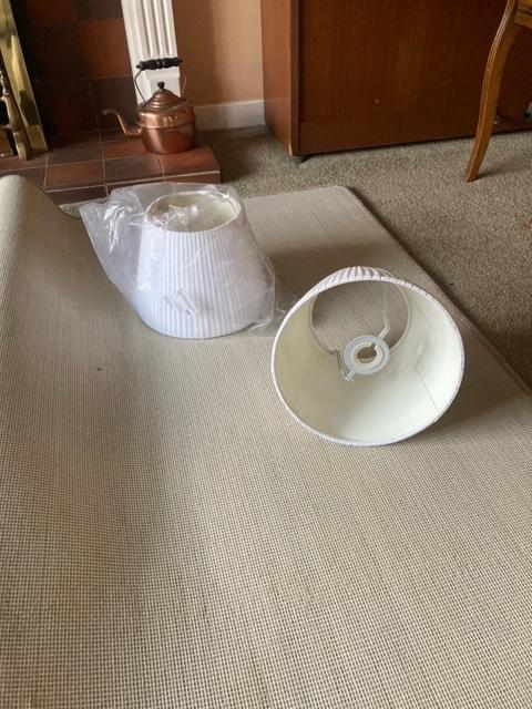 Preview of the first image of Two white, pleated material lampshades.