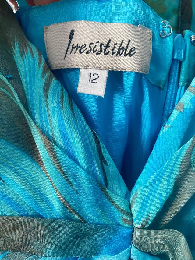 Preview of the first image of Veromia irresistible silk dress with matching scarf..