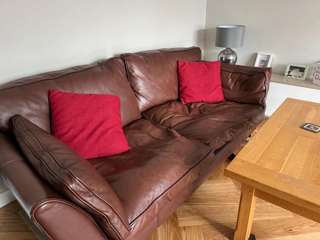 Preview of the first image of Dark Brown Leather Sofas x 2.