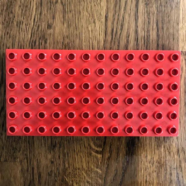 Preview of the first image of Vintage 1980's Lego Duplo red base board 12x6. Can post..