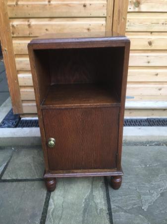 Image 1 of A Wareing & Gillow oak cabinet with turned feet.