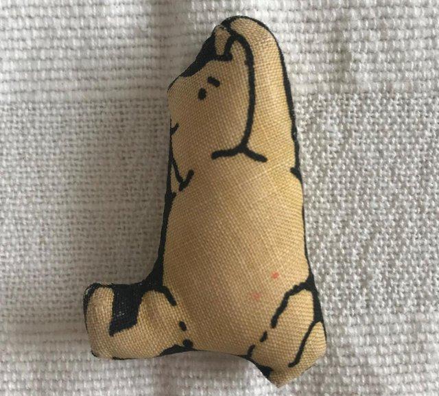 Preview of the first image of Tiny fabric Winnie the Pooh. Approx max 2” x 1½”.