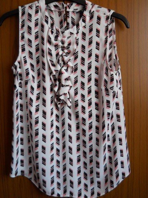 Preview of the first image of Sleeveless Blouse Size 6 - Pink and Black Geometric Design.
