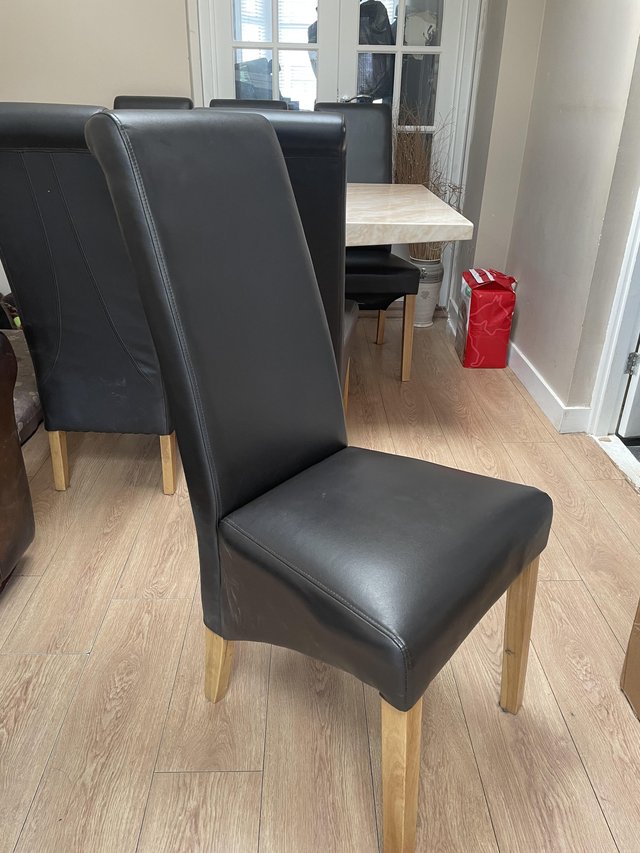 Preview of the first image of Brown faux leather dining chairs - 6.