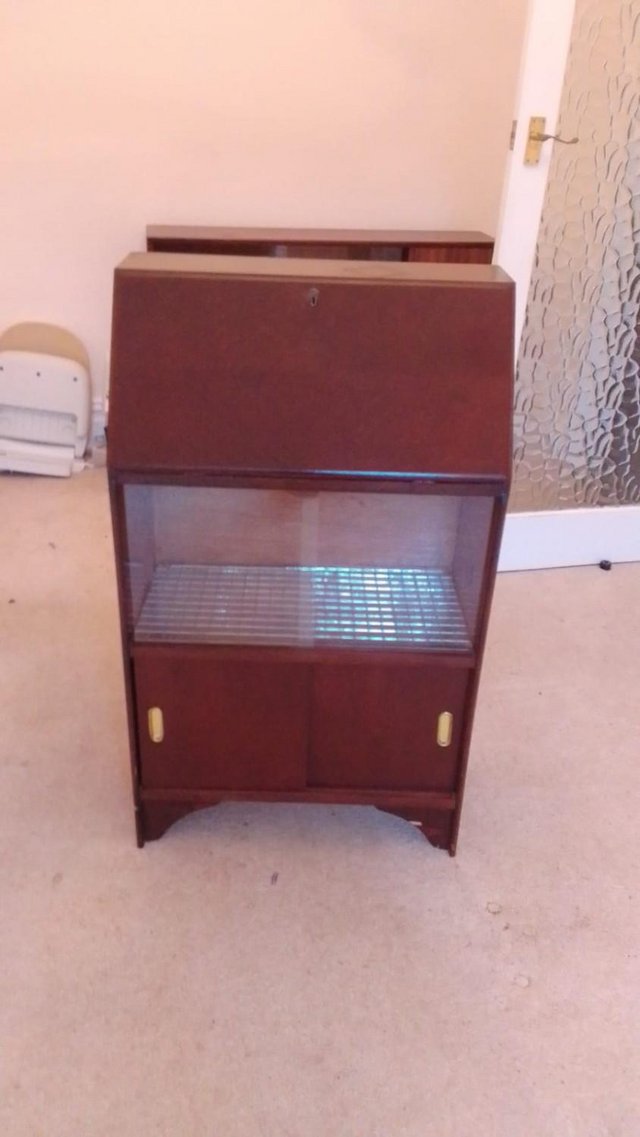 Preview of the first image of Cabinet - with bureau style top, display area and storage.
